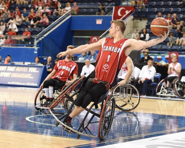 Liam Hickey - Canada male wheelchair basketballer Liam Hickey tilts sideways as he prepares to throw the ball
