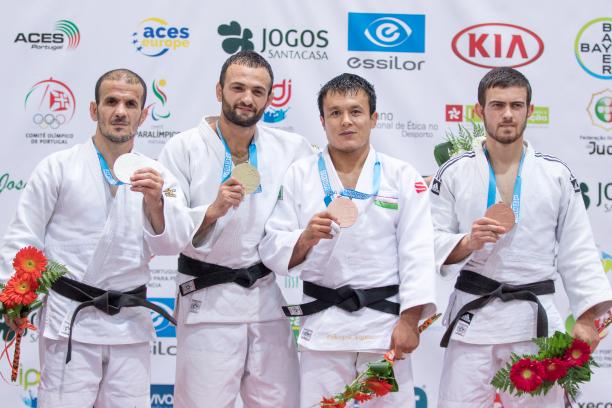 four male judokas on the podium with their medals, with Giorgi Gamjashvili on the end holding bronze