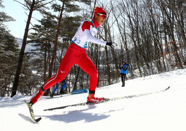 Taiki Kawayoke male Para Nordic skier Taiki Kawayoke skis through the forest