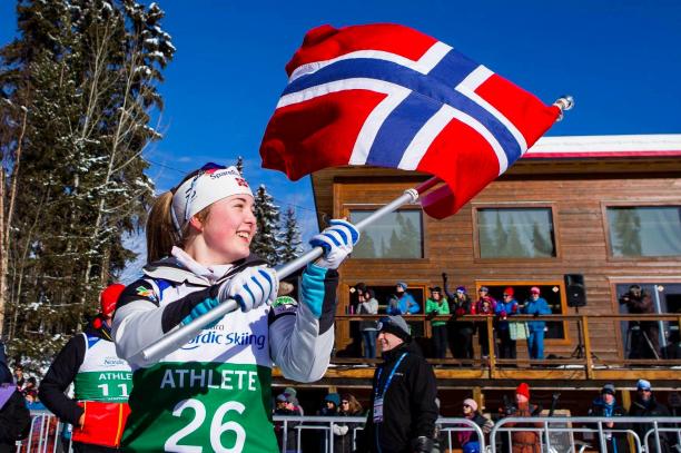 Vilde Nilsen female Para Nordic skier Vilde Nilsen holds up a Norwegian flag