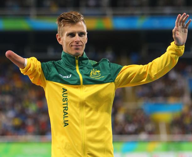 Michael Roeger - Rio 2016 male Para athlete Michael Roeger raises his arms on the podium