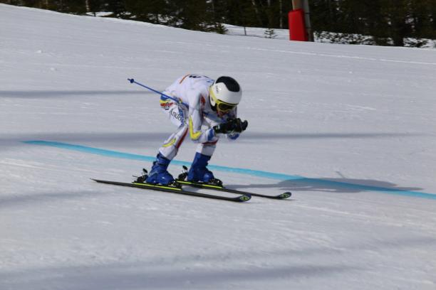 Roger Puig Davi - Klovsjo 2019 male Para alpine standing skier Roger Puig Davi crouches down as he crosses the finish line