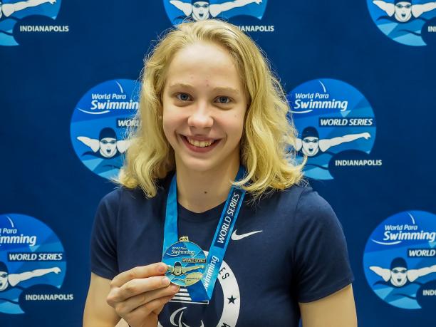 Julia Gaffney - Indianapolis 2019 female Para swimmer Julia Gaffney smiles and holds up a gold medal
