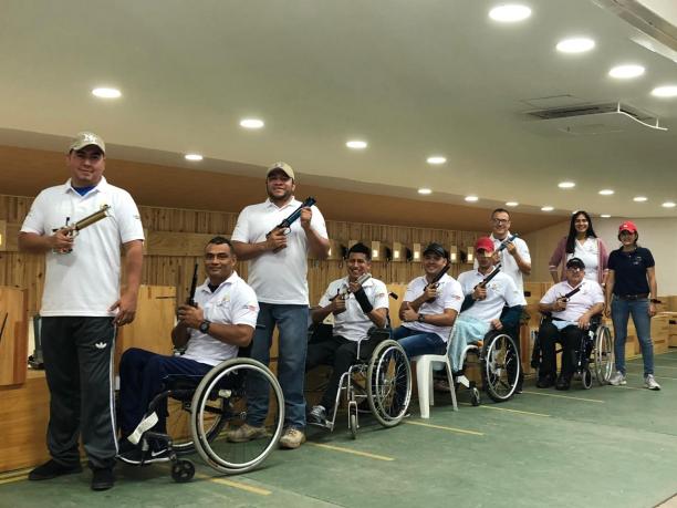 Colombia shooting team a group of male and female Para shooters from Colombia next to the target range