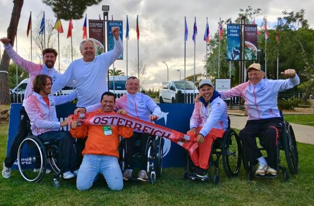 Austria - World Team Cup Euro Qualification male wheelchair tennis players from Austria holding up Austrian scarves and flags