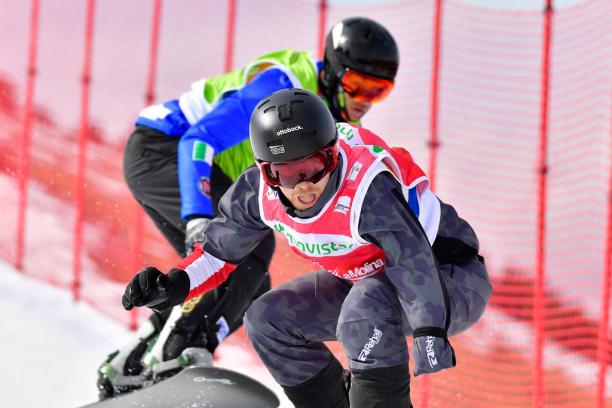 Patrick Mayrhofer - La Molina 2019 male Para snowboarder Patrick Mayrhofer rides in front of another snowboarder