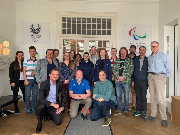 Alpine and Nordic VI classification meeting a group of people standing and sitting and smiling