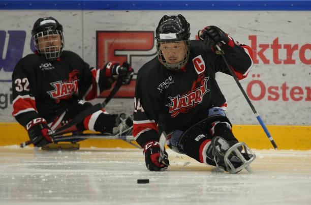 Saturo Sudo - Japan - Para ice hockey Japanese male Para ice hockey player skates with the puck