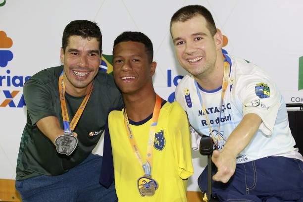 Gabriel Geraldo dos Santos - Sao Paulo 2019 three male Para swimmers with their medals on the podium