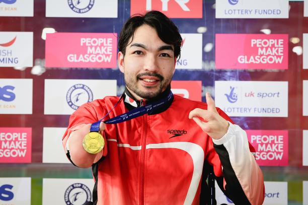 Takayuki Suzuki - Glasgow 2019 male Para swimmer Takayuki Suzuki holds up his gold medal