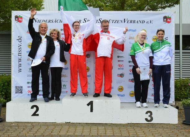 Barbara Moskal - Poland - shooting Three vision impaired shooting Para sport athletes on the podium with their guides
