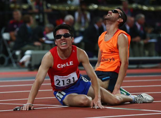 Cristian Valenzuela - Chile Chilean athlete and his guide on the floor exhausted after a race