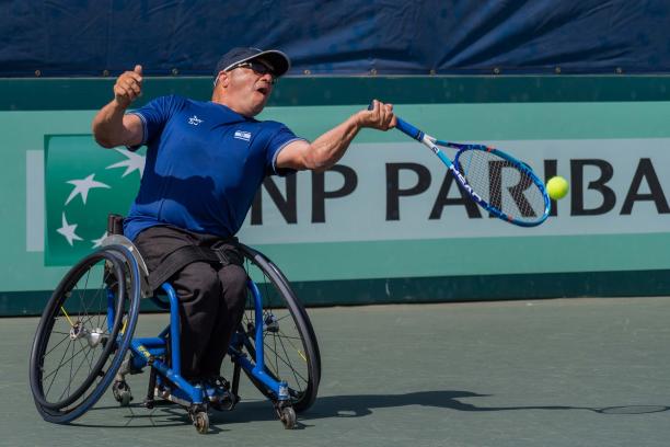 Israeli left-handed wheelchair tennis player Shraga Weinberg hits the ball during a game contested on a hard court