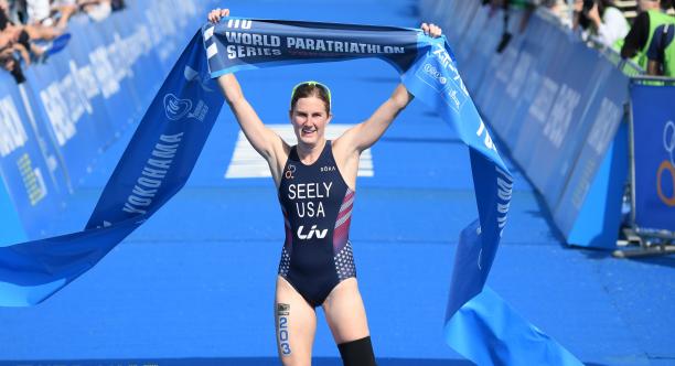Allysa Seely - triathlon - USA Female triathlete with left leg amputation celebrates as she crosses the finish line