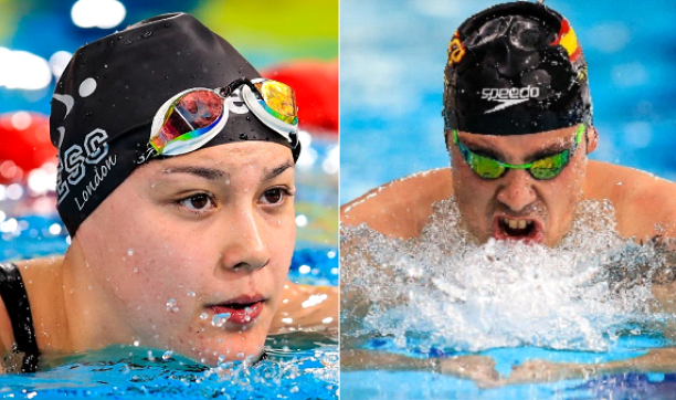 A female and a male swimmer in the water