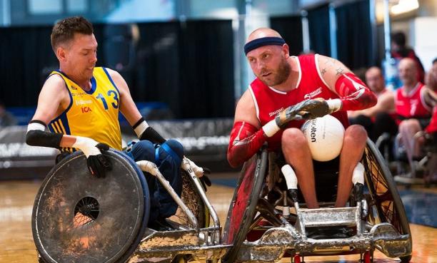 Stefan Jansson - Sweden - wheelchair rugby male wheelchair rugby player Stefan Jansson tackles another player