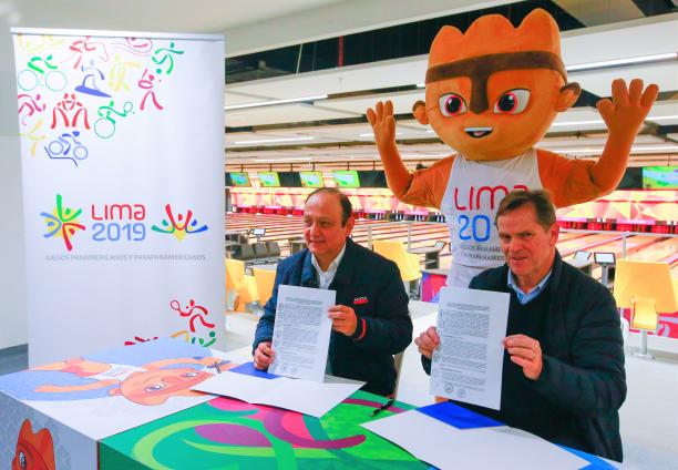 Lima 2019 - agreement to promote accessibility Lima 2019 President Carlos Neuhaus and Peruvian Ombudsman Walter Gutierrez holding the signed contracts