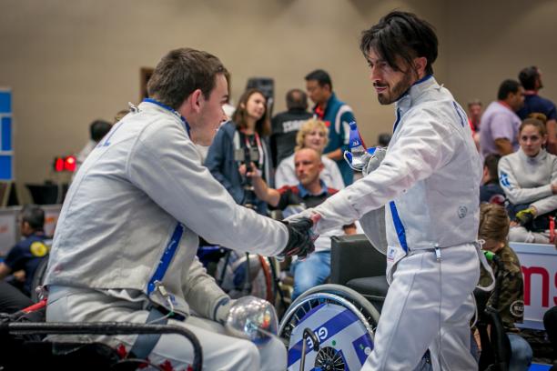Iraq refugee Wissam Sami greets Canada's Ryan Roussel during the IWAS Wheelchair Fencing World Cup in Warsaw, Poland