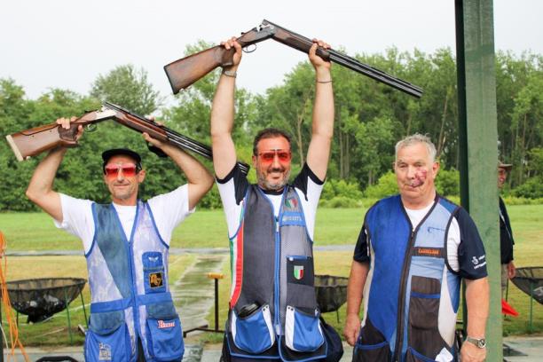 Saverio Cuciti - Italy - Osijek 2019 World Shooting Para Sport World Cup Three male Para trap shooters pose together with man in middle raising his shot gun over his head