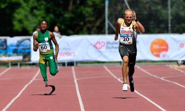 Puseletso Mabote of South Africa and Noah Bodelier of Germany - Nottwil 2019 World Para Athletics Junior Championships Two young men running on an athletics track