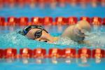 A picture of a woman swimming, paralympic swimming