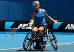 Germany's Sabine Ellerbrock sits in her wheelchair and hits a tennis ball.
