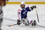 A picture of the ice sledge hockey player on the field