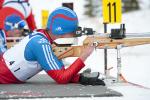 Azat Karachurin lies to shoot a gun in hte short course biathlon event