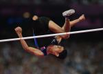 Andy Avellana of the Philippines jumps over the bar in the men's high jump.