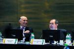 Picture of IPC Chief Executive Xavier Gonzalez and his Rio 2016 counterpart Sidney Levy dressed in suits seated behind two microphones on a table in a formal meeting.