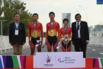 Three Chinese athletes standing on the podium