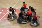 A picture of Wheelchair Rugby players in action.