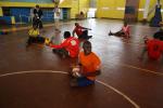 athletes practicing sitting volleyball