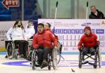 An athlete from the Korean Wheelchair Curling Team celebrates a point on Day 4 of the 2012 World Wheelchair Curling Championships