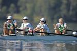A picture of four people rowing 