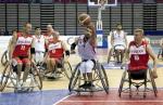 Man in wheelchair with basketball