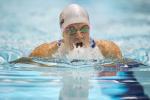 A visually impaired athlete swims