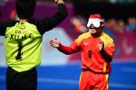 Blindfolded football player celebrates