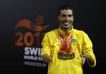 Daniel Dias of Brazil poses with his seven gold medal he won at the IPC Swimming World Championships in Glasgow, Great Britain.
