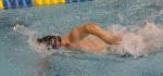 A Para swimmer competes in a race
