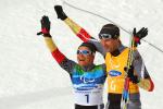 Verena Bentele and her guide Thomas Friedrich of Germany celebrate winning the Women's 3km Pursuit Visually Impaired Biathlon at the 2010 Vancouver Winter Paralympics.