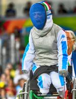 Wheelchair fencer celebrates with her mask on