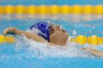Close up of a swimmer with an impaired arm doing backstroke.