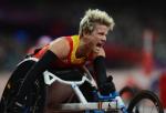 A picture of a woman in a wheelchair screaming after her victory in an athletics race