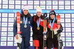 Picture of three female skiers on the podium.