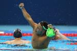 a para swimmer celebrates in the pool
