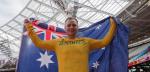 An athlete poses with the Australia flag after winning gold
