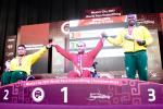 three male powerlifters on the podium
