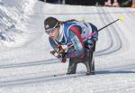 Oksana Masters skiing on a sit-ski