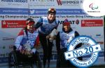 three female Para Nordic skiers smile on the podium